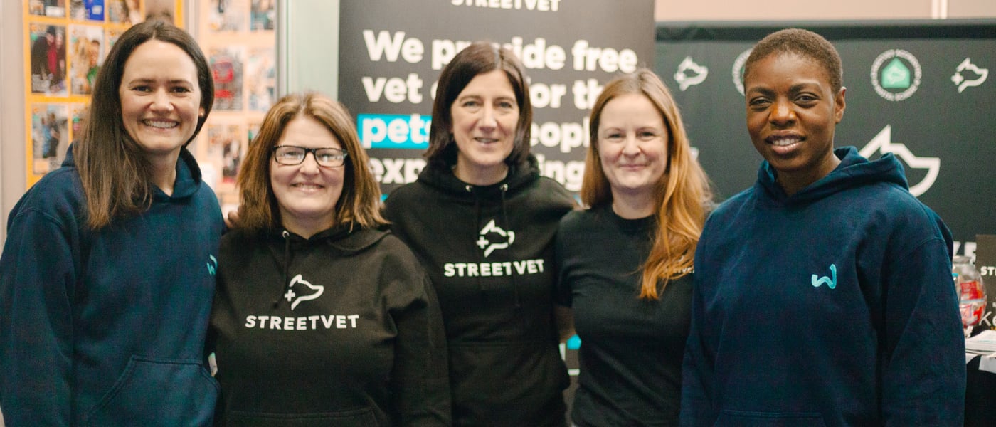 Members of Waggel and StreetVet stood in a line and smiling.