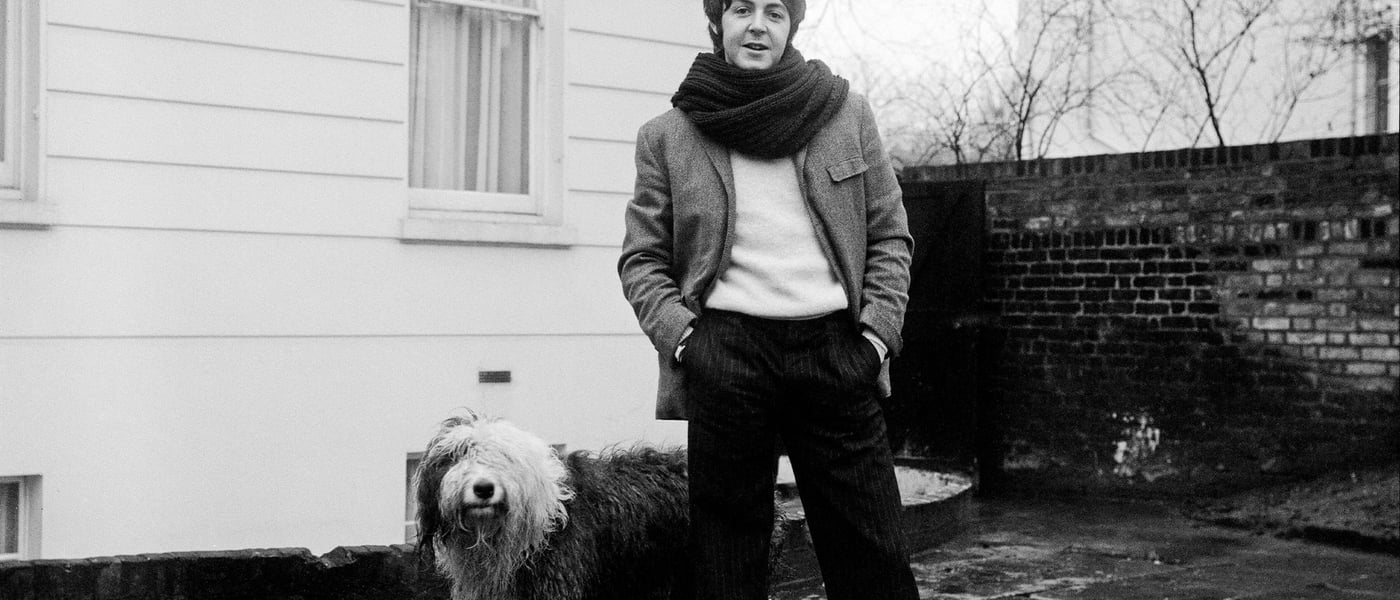 Paul McCartney and his dog Martha stood outside their home.