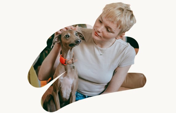 A photo cutout of a woman stroking a dog