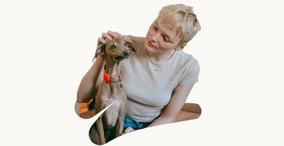 A photo cutout of a woman stroking a dog