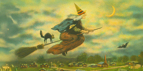 drawing of witch and black cat on a broom