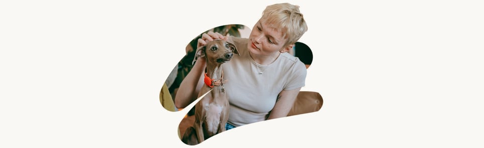 A photo cutout of a woman stroking a dog